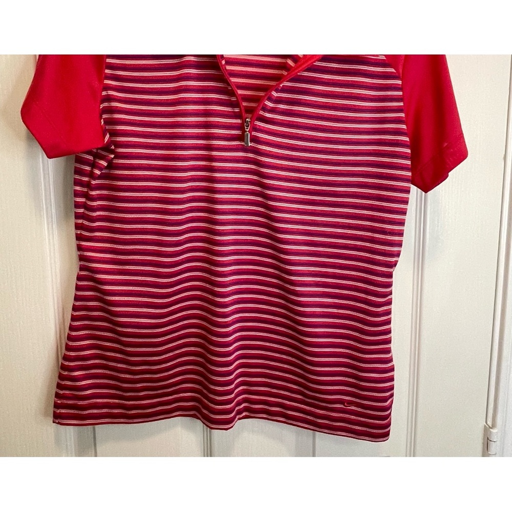 Nike Fit Dry women’s golf top.  Red background with white and blue stripes.